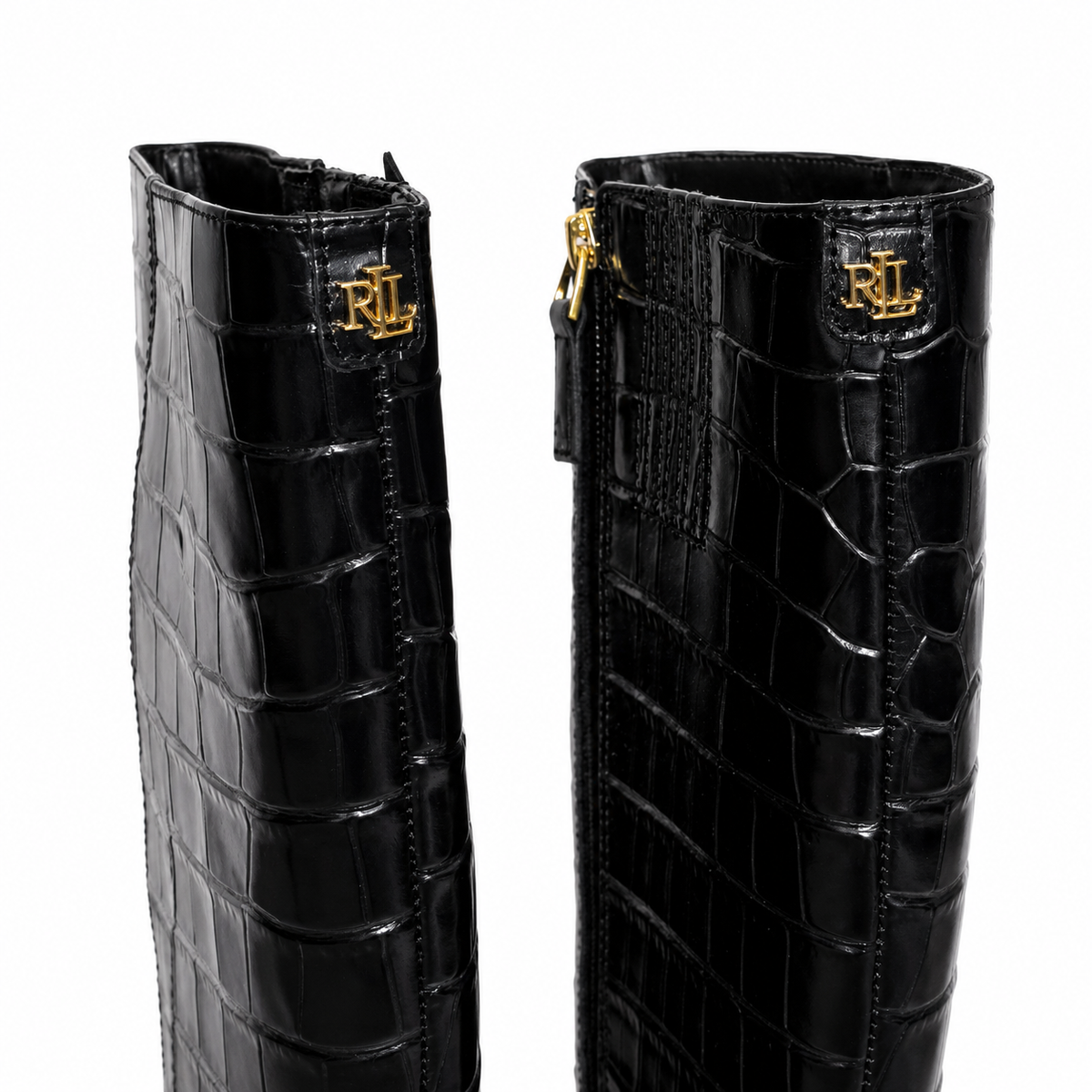 A pair of black crocodile-embossed leather boots shown from the side, featuring gold-tone metal zippers and a gold RL monogram logo on the collar, set against a plain white background.