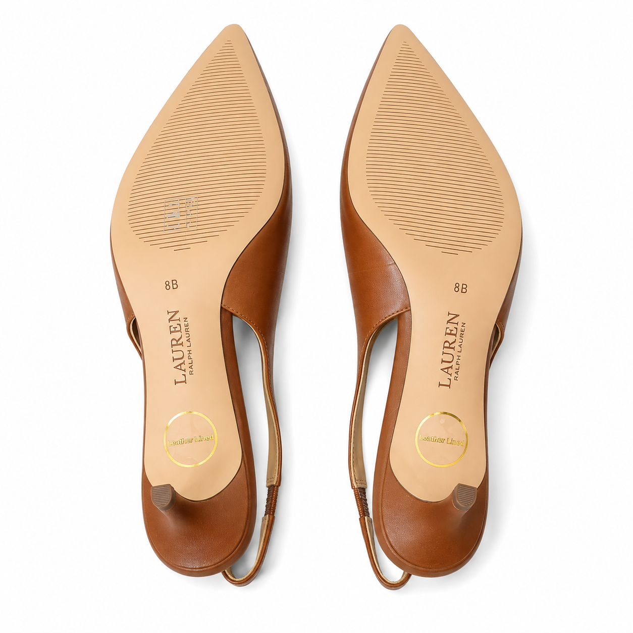 A pair of Lauren Ralph Lauren pointed-toe slingback flats shown from the sole, featuring tan leather uppers and beige insoles with the brand name printed vertically.