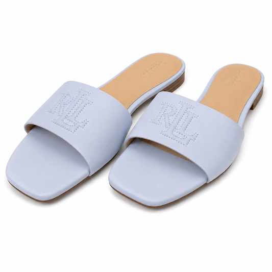A pair of light blue slide sandals with a square toe and an embossed 'RL' logo on the strap, shown on a white background.