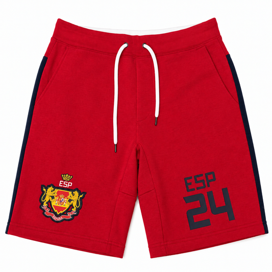 Red athletic shorts with white drawstrings, navy side stripes, a yellow and red crest on the left leg, and 'ESP 24' printed in navy on the right leg, shown flat on a white background.