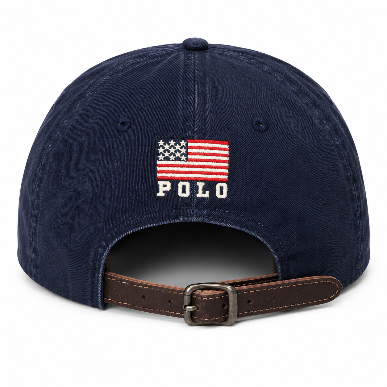 A navy blue baseball cap featuring an embroidered American flag with the word 'POLO' underneath, shown from the back with a brown leather strap and metal buckle.