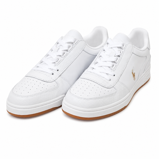 A pair of white leather low-top sneakers with white laces, a small gold polo player logo on the side, and a brown gum sole, shown on a clean white background.