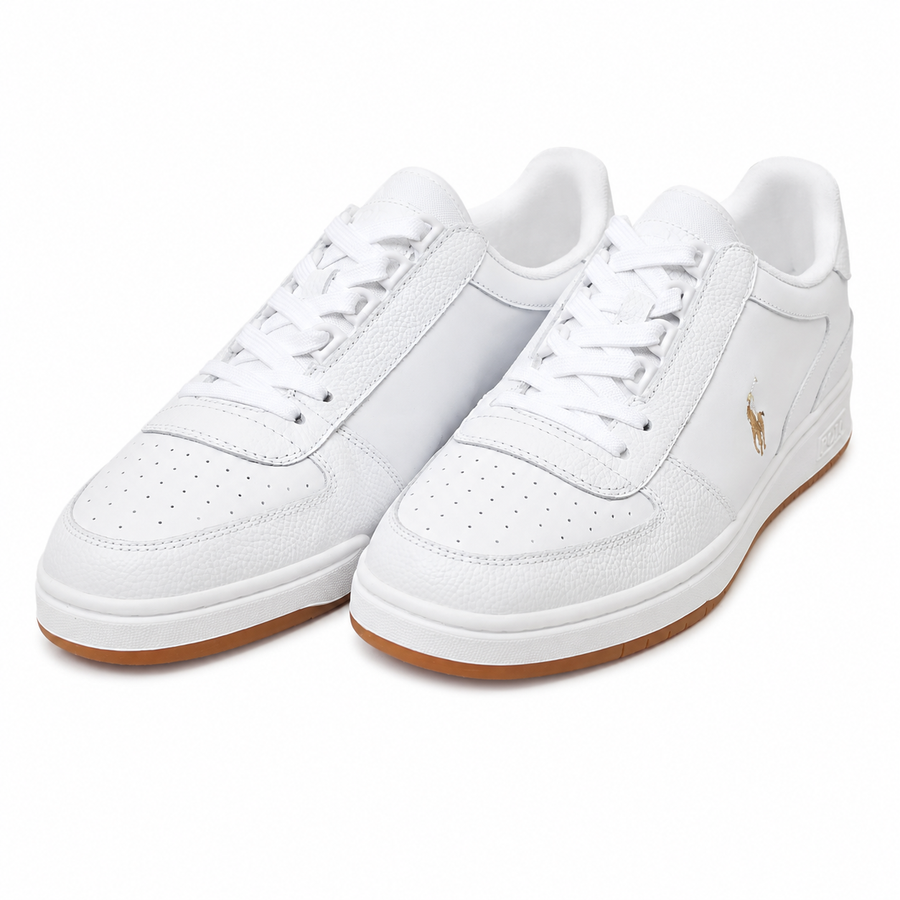 A pair of white leather low-top sneakers with white laces, a small gold polo player logo on the side, and a brown gum sole, shown on a clean white background.