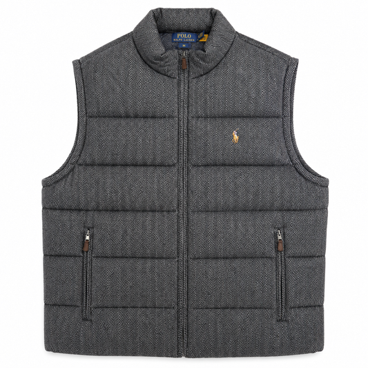A dark gray herringbone quilted puffer vest with a full-zip front, stand-up collar, and two vertical zippered pockets. The iconic embroidered polo player logo is visible on the left chest, indicating the Polo Ralph Lauren brand.