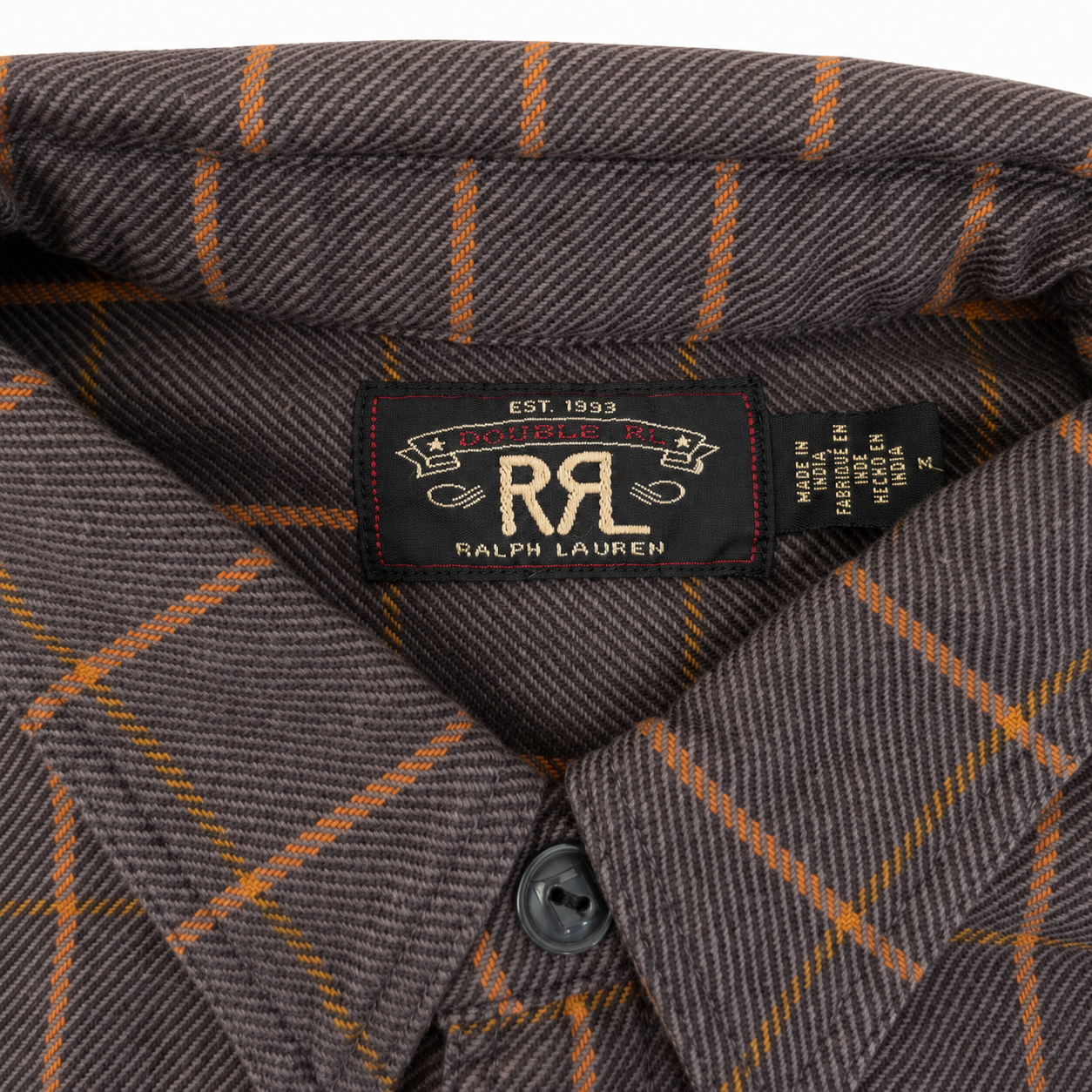 Close-up of a Ralph Lauren button-down shirt collar showing the brand label and a brown and orange windowpane plaid pattern.