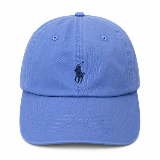 A classic blue cotton baseball cap featuring the embroidered dark blue Polo pony logo on the front, set against a plain white background.