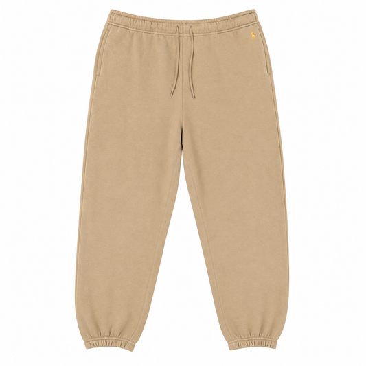 A pair of beige fleece jogger pants with an elastic waistband, matching drawstrings, side pockets, and elastic cuffs, shown flat on a white background.