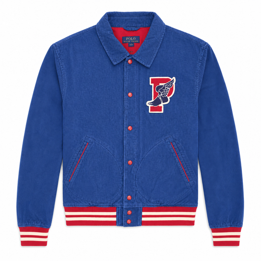 A blue denim varsity-style jacket with red and white striped ribbed cuffs and hem, featuring a red embroidered chest patch with a white winged letter P and a black-and-white shoe motif. The brand name 'ROCKNROLLER' is visible on the inner neck label.
