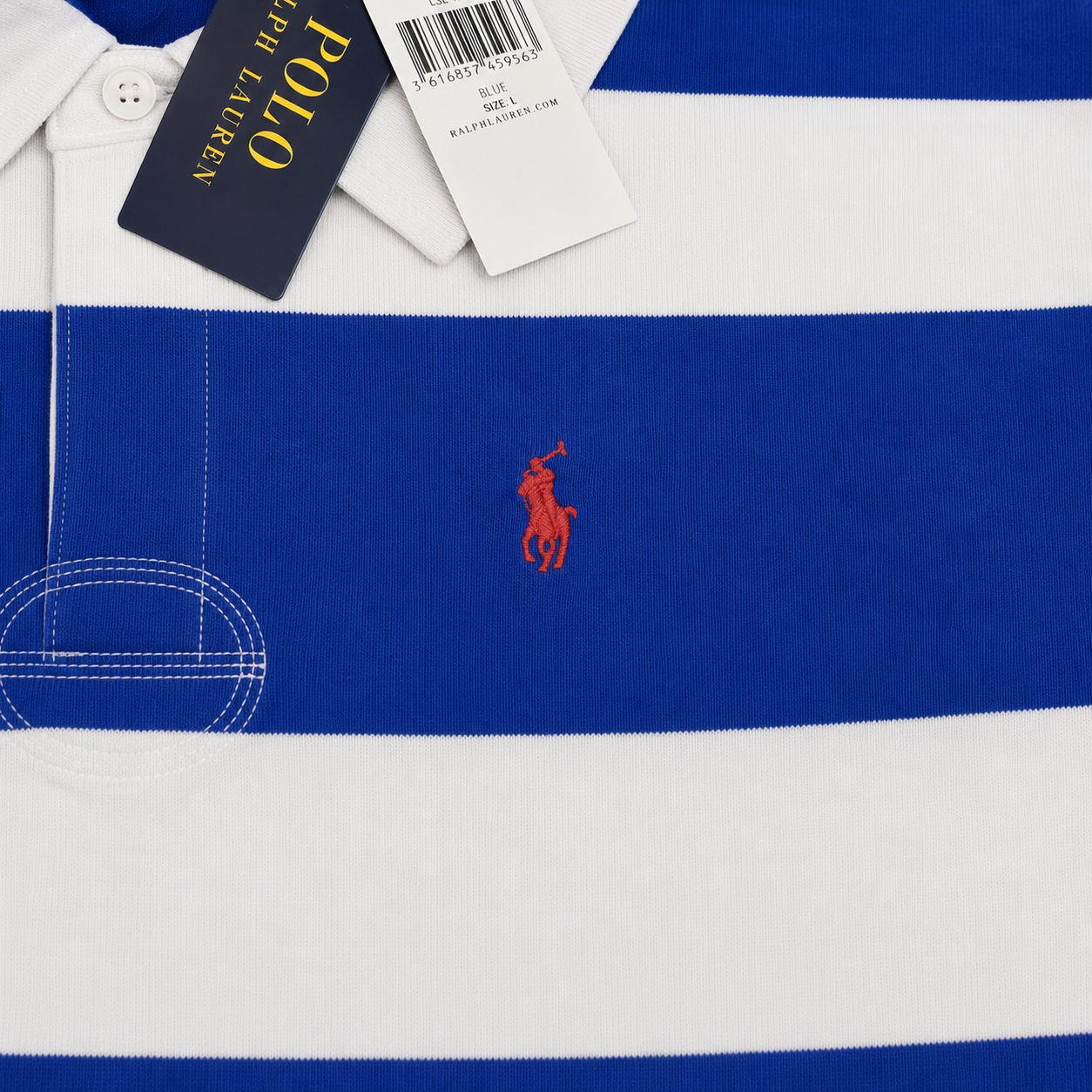 A close-up of a Polo Ralph Lauren striped polo shirt in royal blue and white, featuring the signature embroidered polo player logo on the chest and retail tags at the collar.