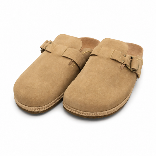 A pair of tan suede clogs with adjustable straps and braided jute-wrapped soles, shown on a clean white background.