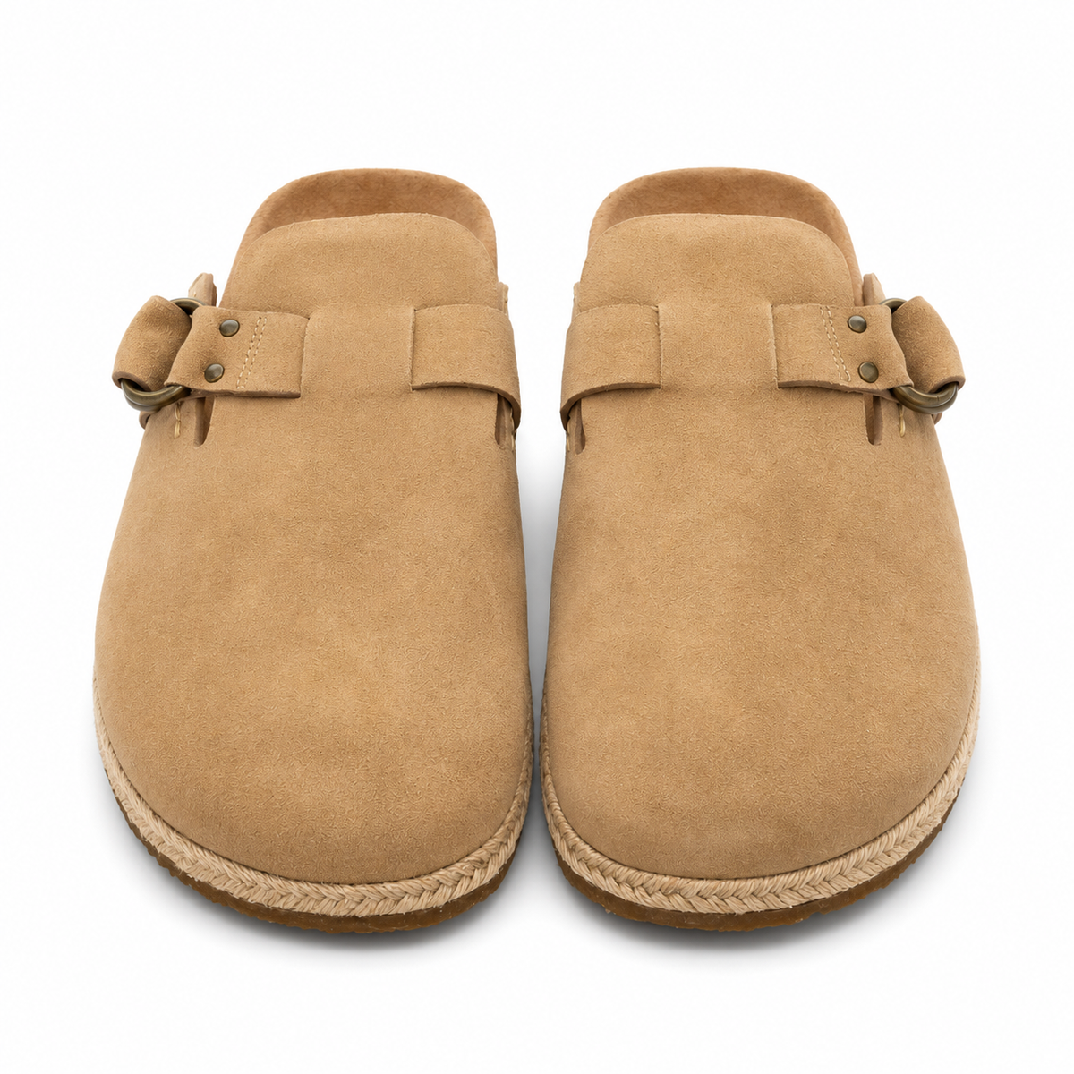 A pair of tan suede clogs with woven jute trim and metal eyelets, shown from a top-down view on a white background.