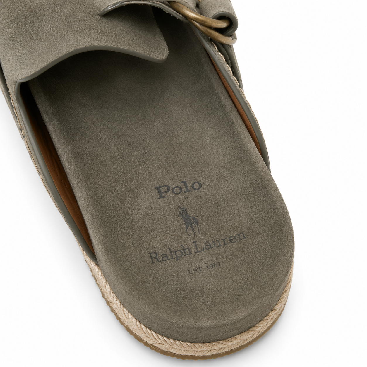 Close-up of the insole of a taupe suede clog sandal by Ralph Lauren Polo, showing the brand logo and name, with a braided jute sole edge visible against a white background.
