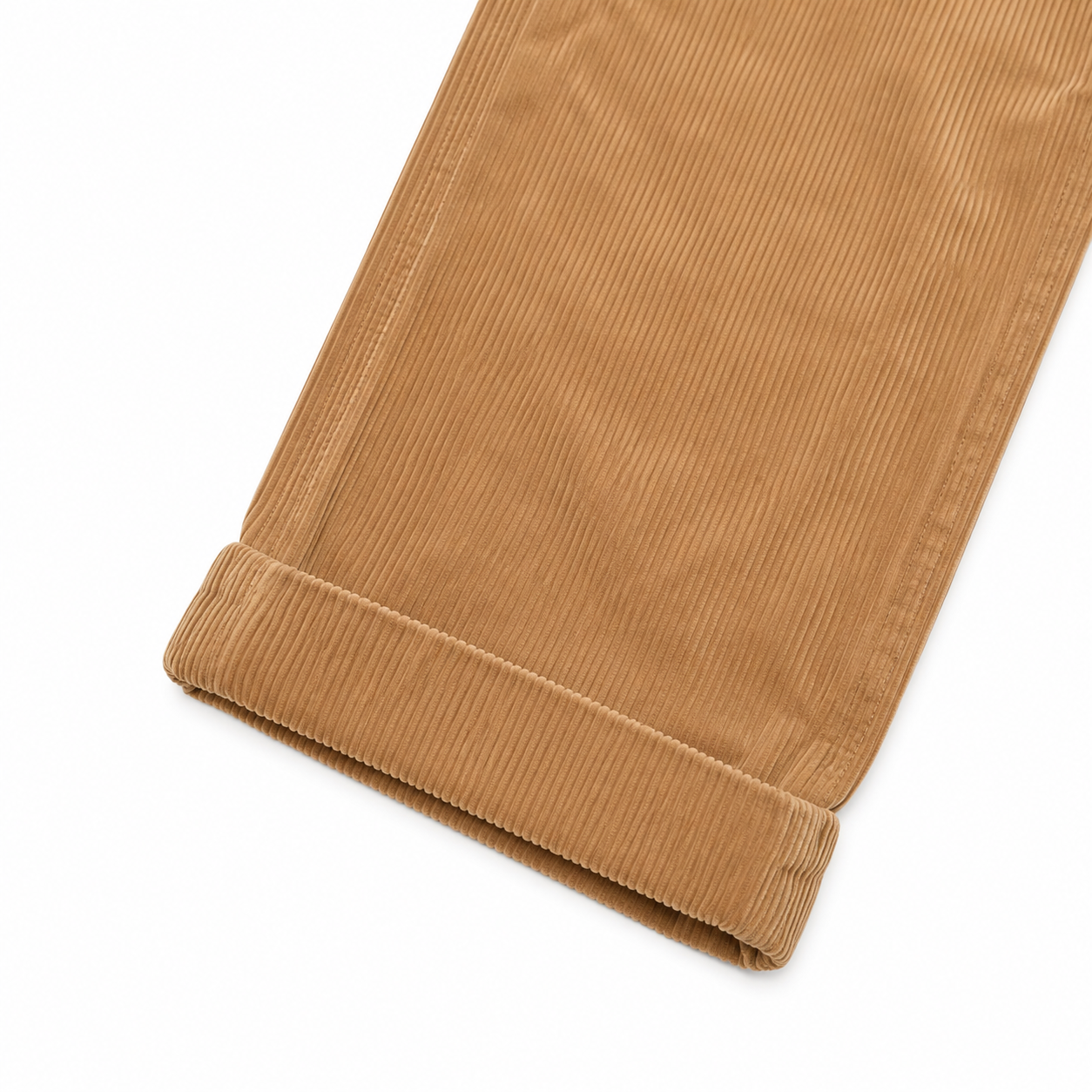 A close-up of a tan corduroy fabric garment, showing the ribbed texture and rolled cuff, on a plain white background.