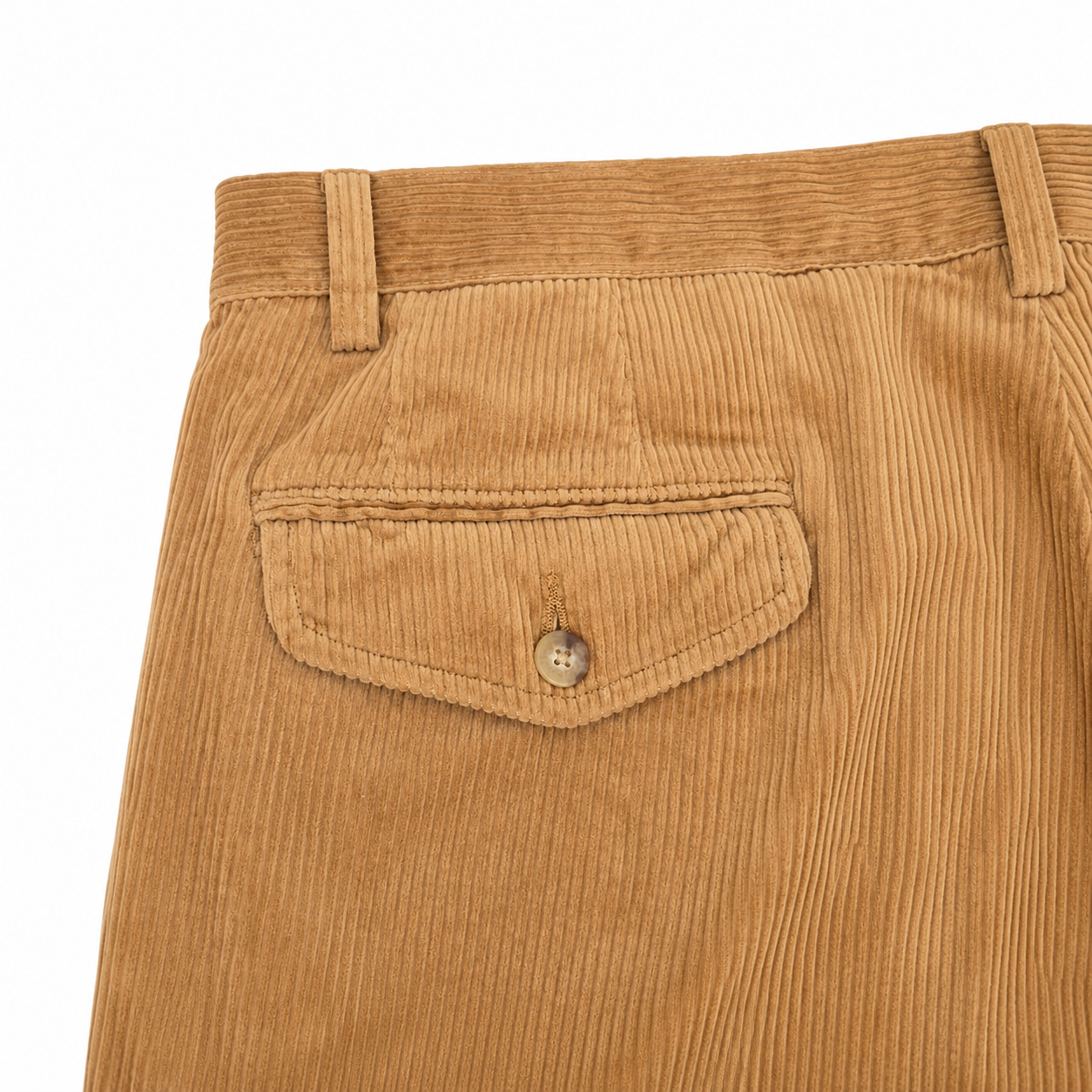 Close-up of the back waistband and pocket area of tan corduroy trousers, showing the ribbed fabric texture and a buttoned welt pocket.