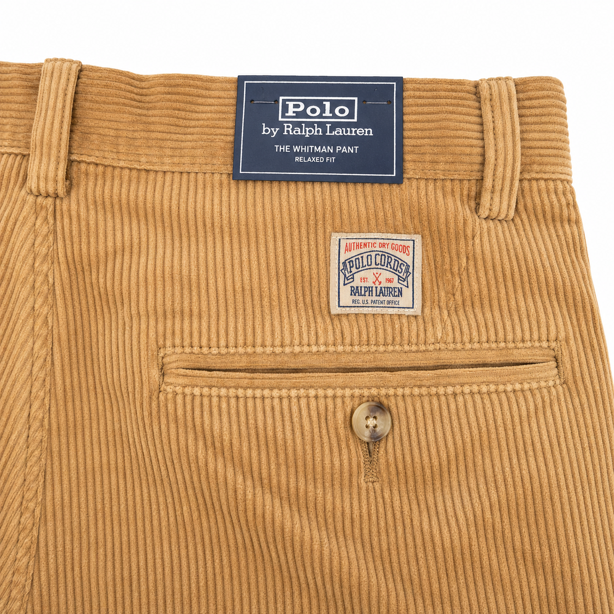 Close-up of tan corduroy pants by Ralph Lauren, showing the waistband, belt loops, back pocket, button, and brand labels.